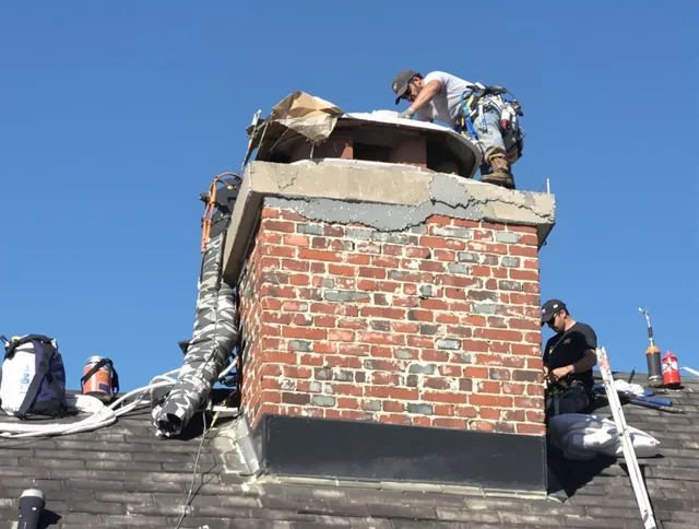 North Ridgeville Chimney Sweep installing a custom chimney crown in North Ridgeville, OH