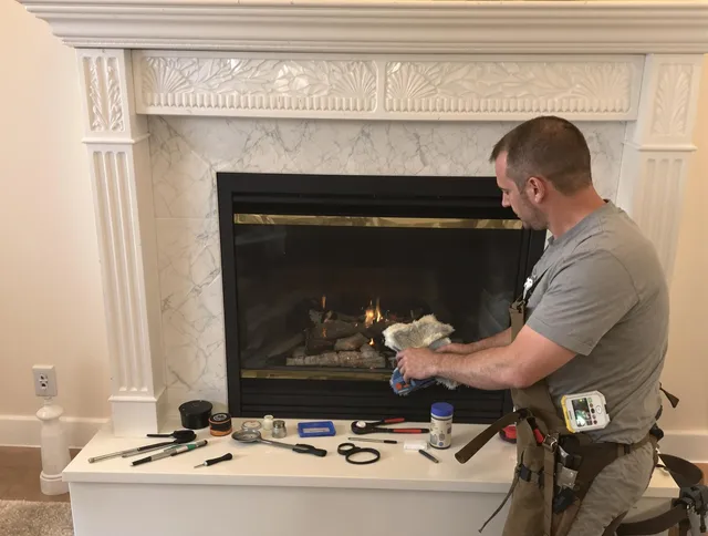 North Ridgeville Chimney Sweep performing fireplace maintenance in North Ridgeville, OH
